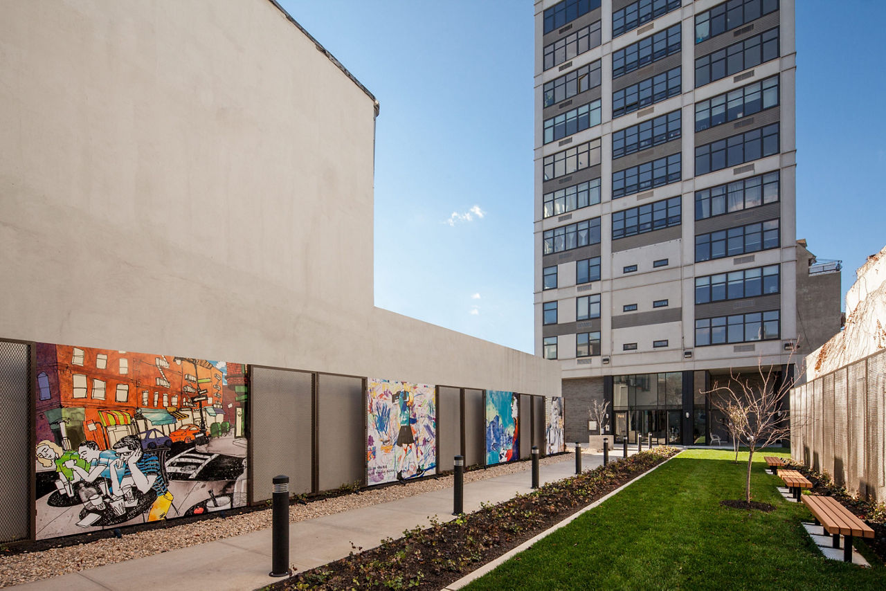 Relaxing courtyard featuring lush gardens and seating at 424 Bedford luxury apartments