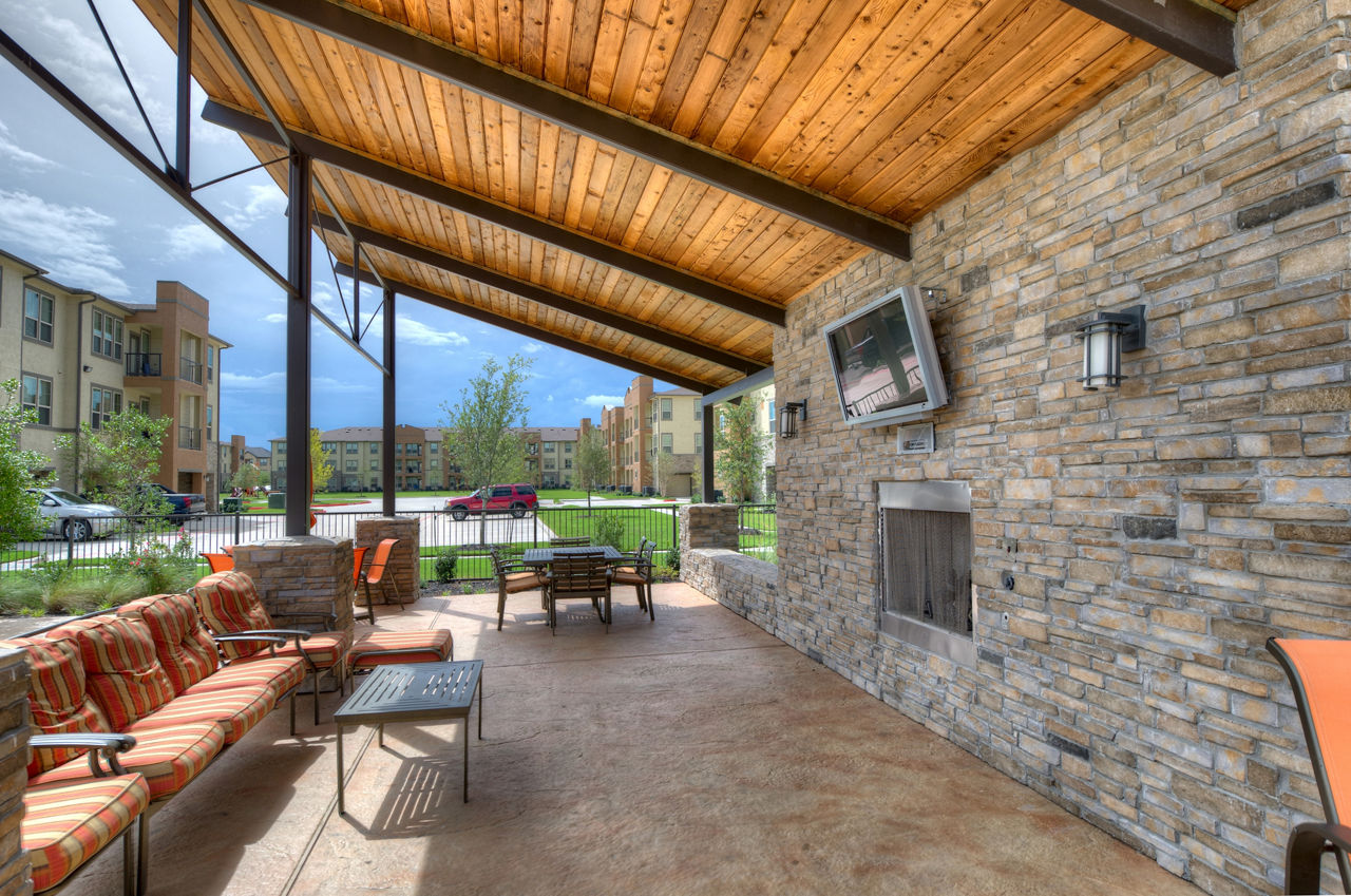 Patio with cozy seating and greenery at Retreat at Shadow Creek Ranch, luxury apartments perfect for outdoor relaxation