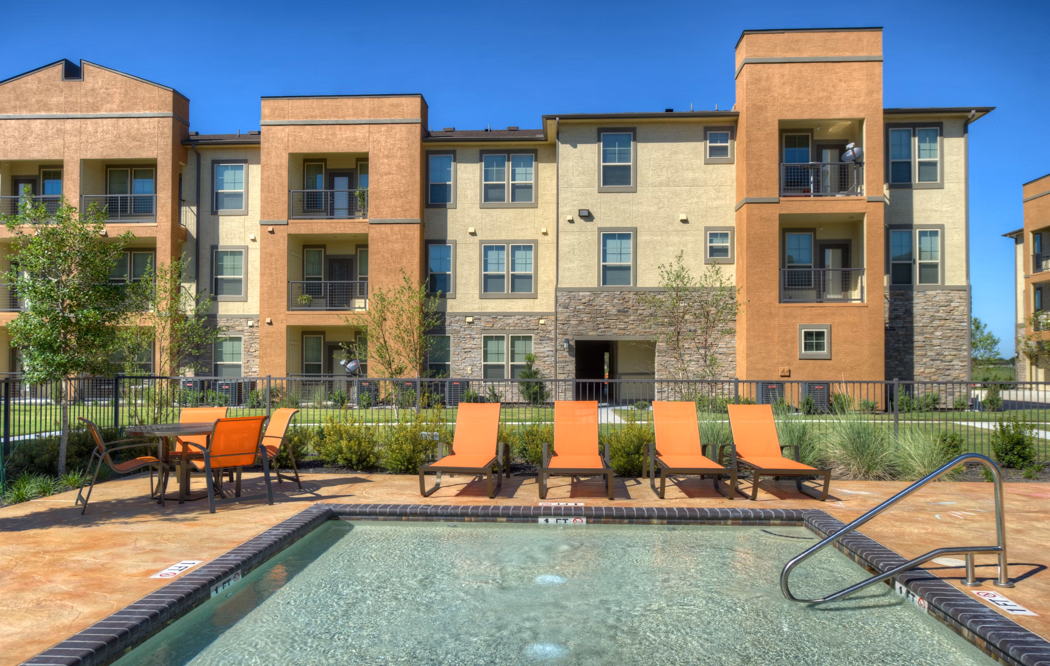 Resort-style pool with sun loungers at Retreat at Shadow Creek Ranch
