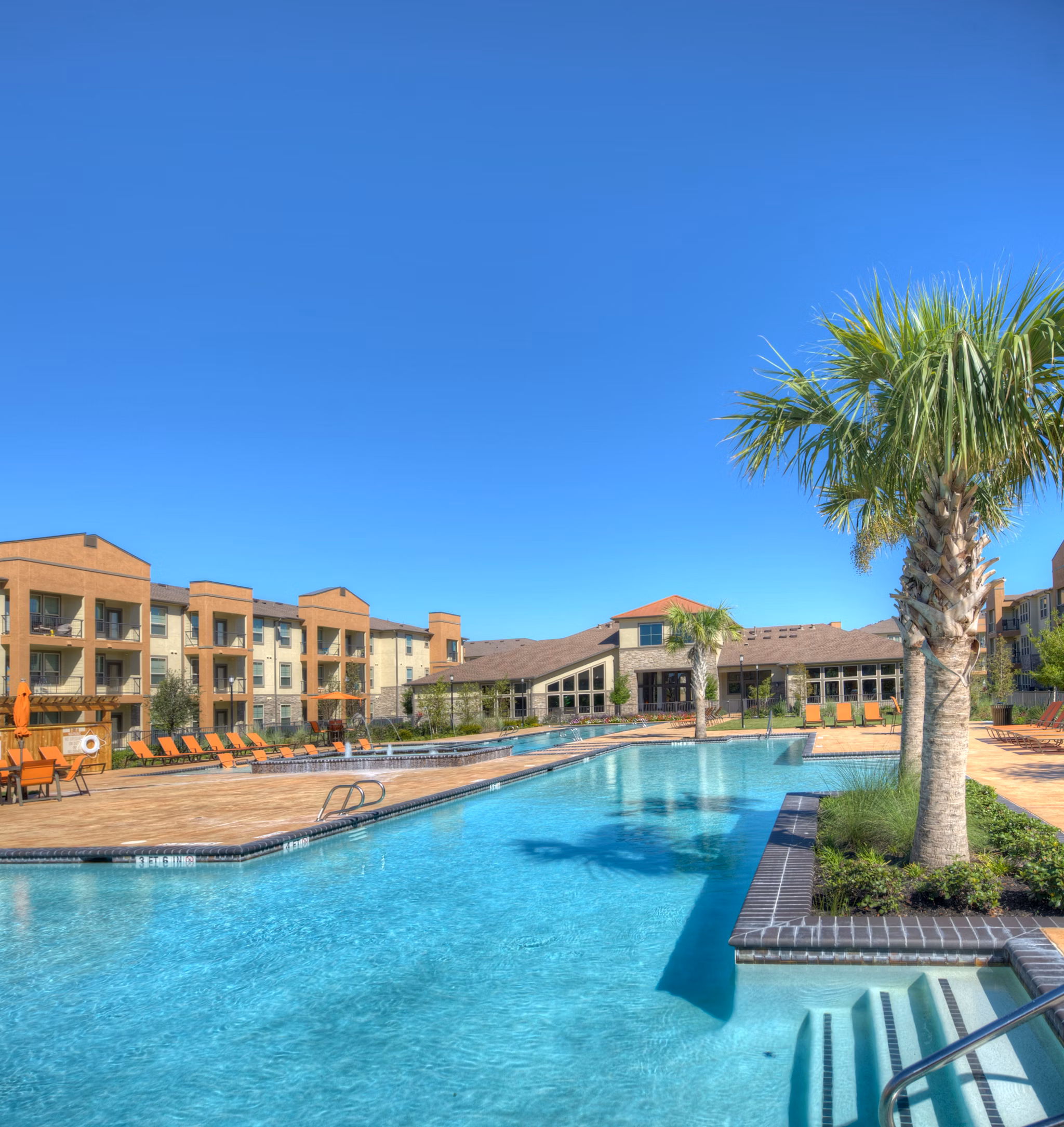 Rooftop pool with lounge chairs at Retreat at Shadow Creek Ranch luxury apartments