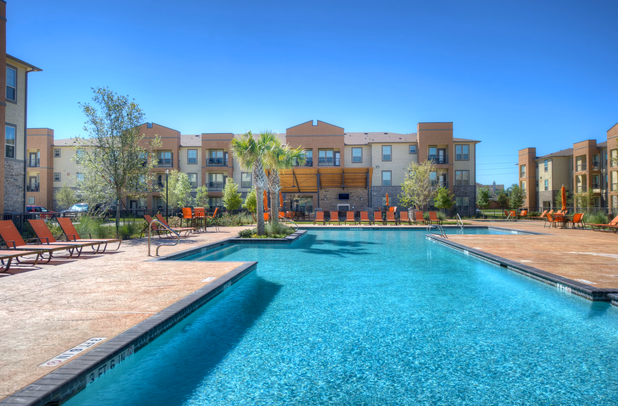 Luxury poolside oasis at Retreat at Shadow Creek Ranch, perfect for relaxation with stylish seating and landscaped surroundings