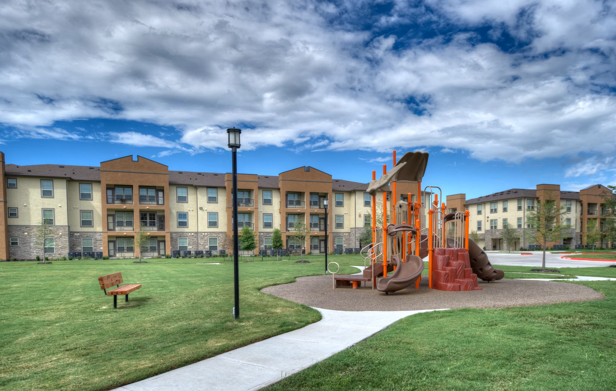 Children's playground with slides and swings at Retreat at Shadow Creek Ranch, offering family-friendly amenities in Texas