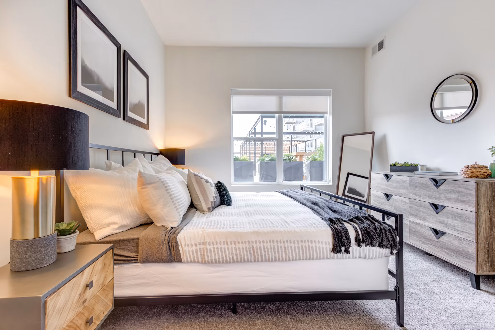 Cozy bedroom with stylish decor at The Marke of Elmhurst Apartments