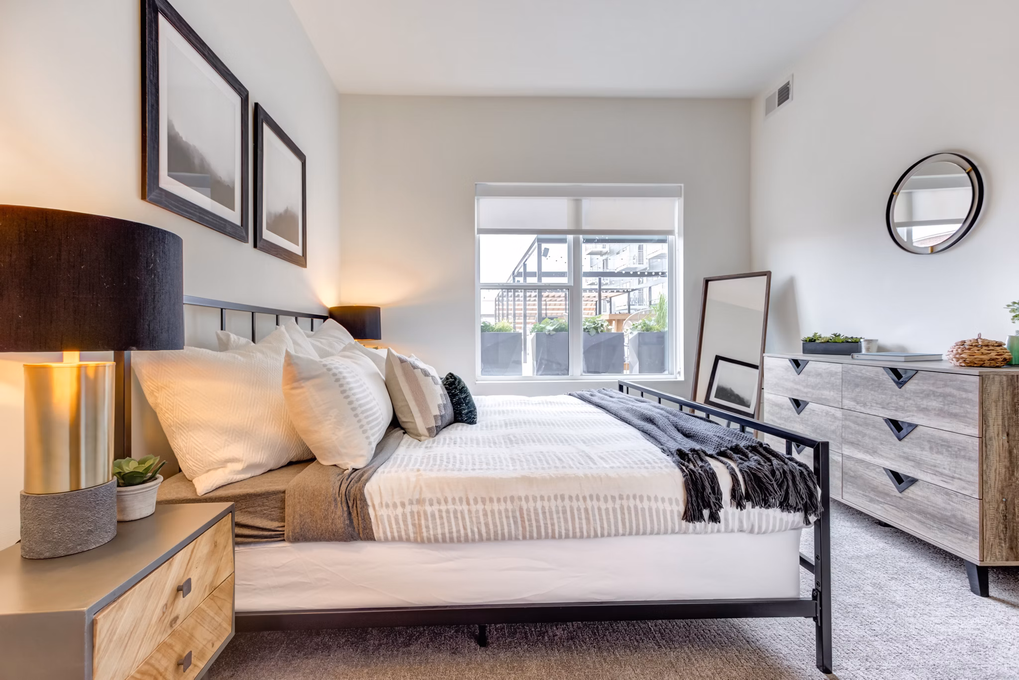 Cozy bedroom with stylish decor at The Marke of Elmhurst Apartments