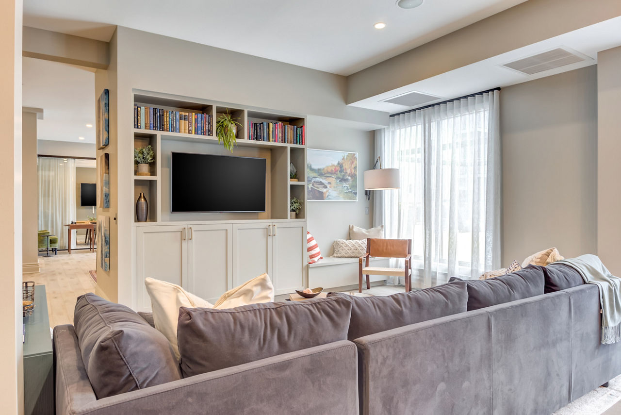 Spacious clubhouse with modern decor at The Marke of Elmhurst Apartments featuring luxury amenities