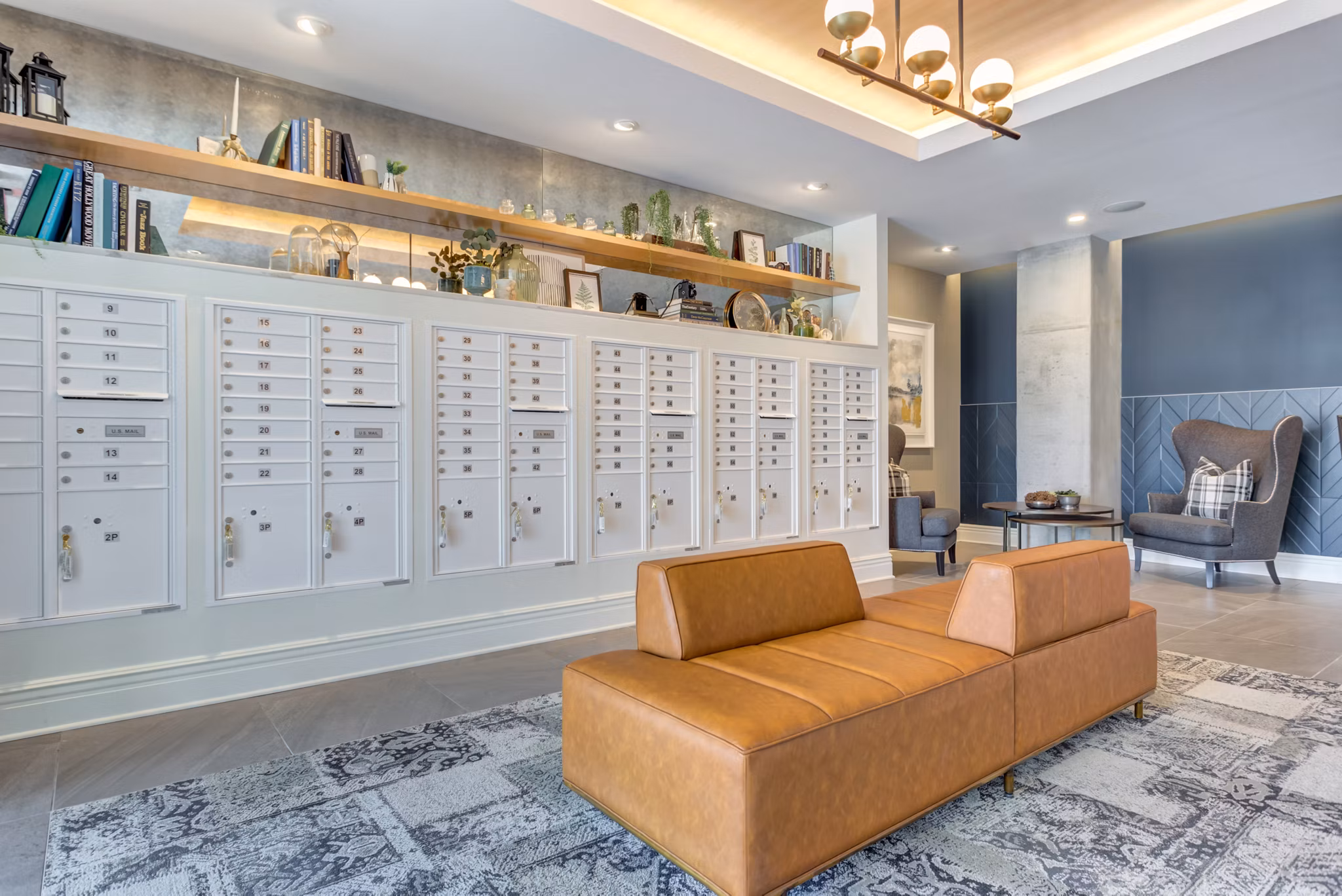 Mail room featuring secure parcel lockers at The Marke of Elmhurst Apartments, ensuring convenient and efficient package retrieval for residents