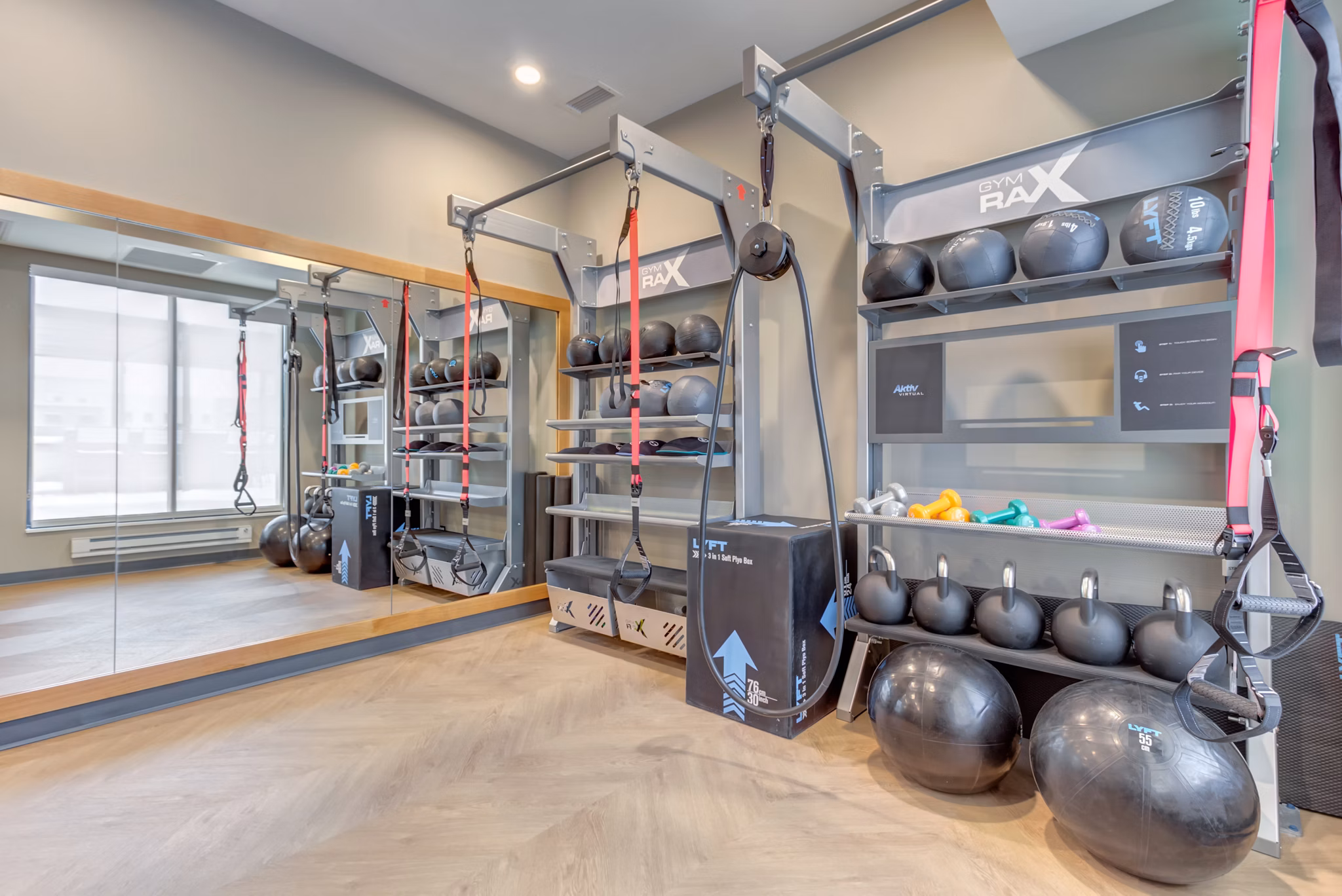 State-of-the-art fitness center at The Marke of Elmhurst Apartments with modern equipment and spacious workout areas for luxury living