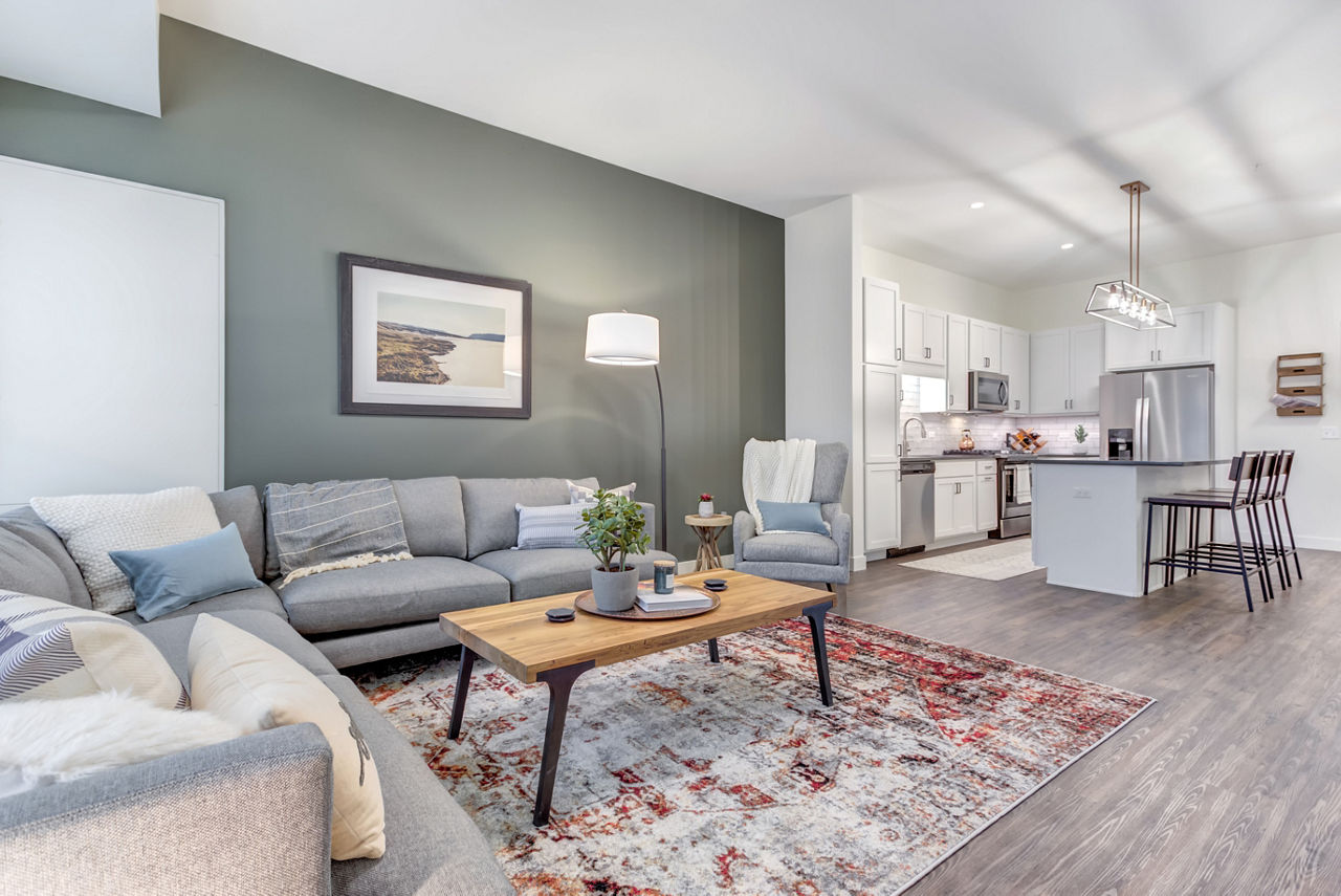 Bright living room with stylish decor in The Marke of Elmhurst Apartments