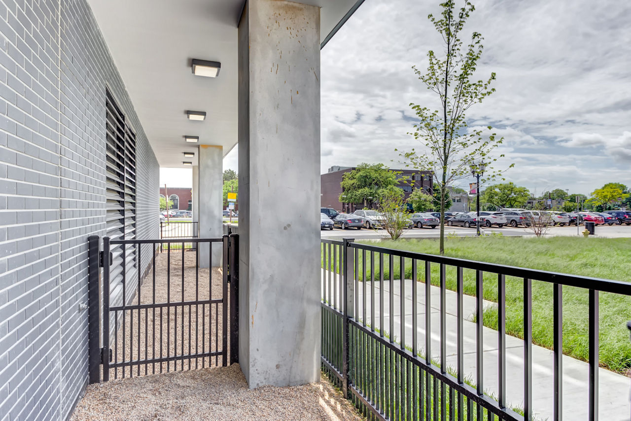 Outdoor patio with modern seating at The Marke of Elmhurst luxury apartments, ideal for relaxation and socializing
