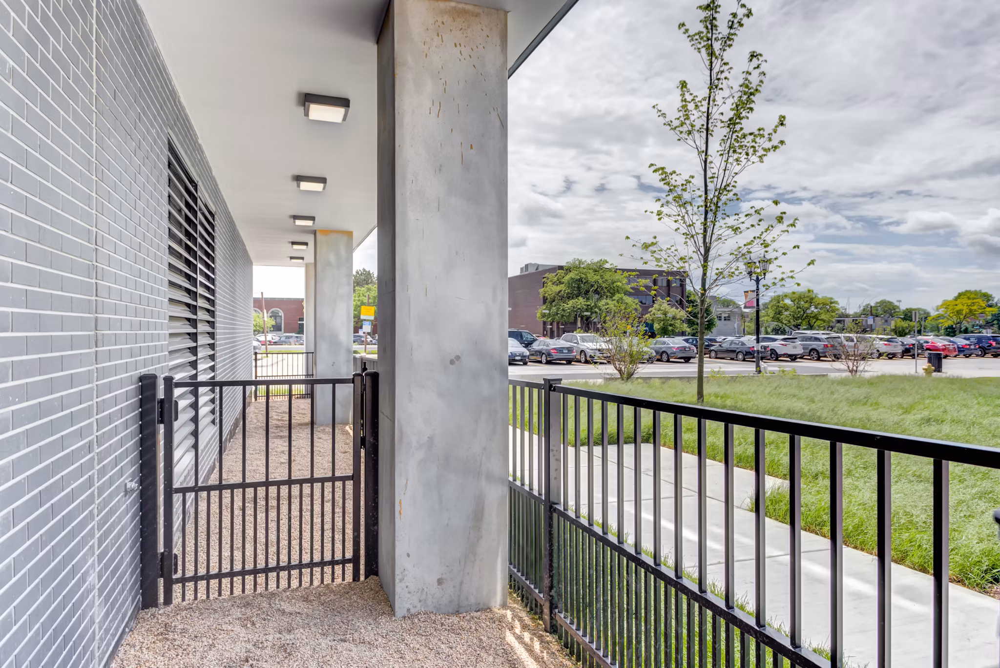 Outdoor patio with modern seating at The Marke of Elmhurst luxury apartments, ideal for relaxation and socializing
