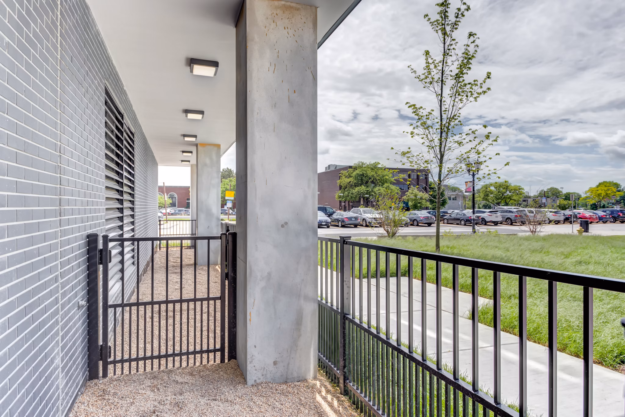 Outdoor patio with modern seating at The Marke of Elmhurst luxury apartments, ideal for relaxation and socializing