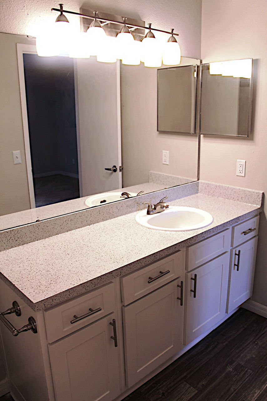 Bathroom featuring modern fixtures and sleek marble countertops at Island Club Apartments luxury apartments