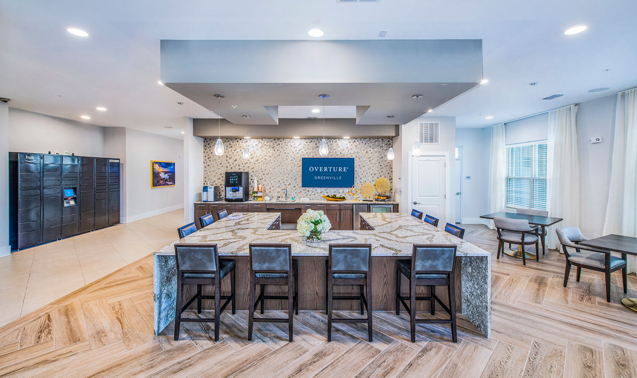 Clubhouse kitchen with modern appliances at Overture Greenville Apartments, offering luxurious spaces for residents to enjoy