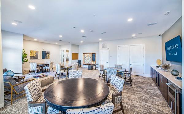clubhouse game room at Overture Greenville Apartments