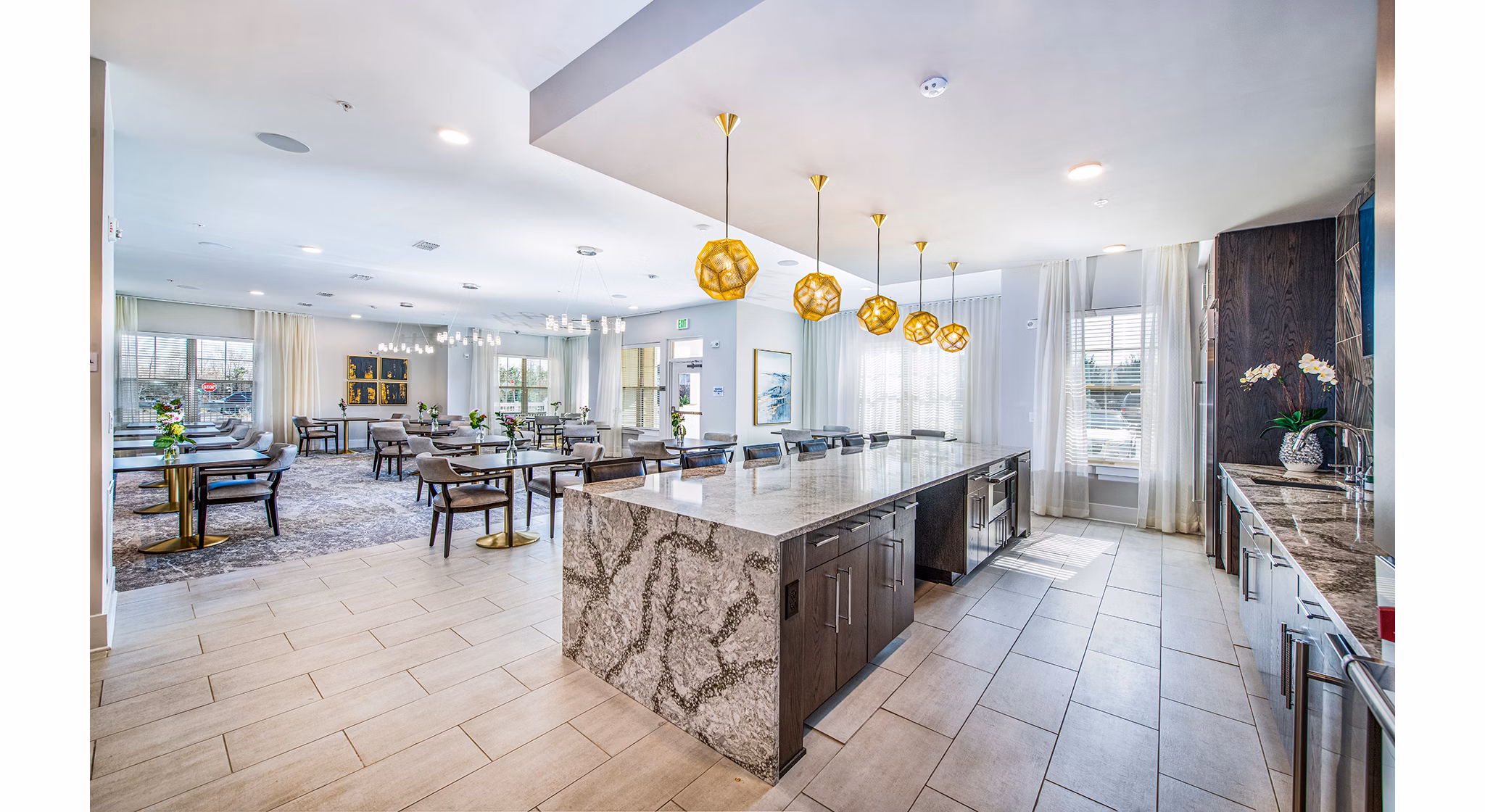 Modern clubhouse kitchen with stainless steel appliances at Overture Greenville Apartments, ideal for social gatherings and culinary events