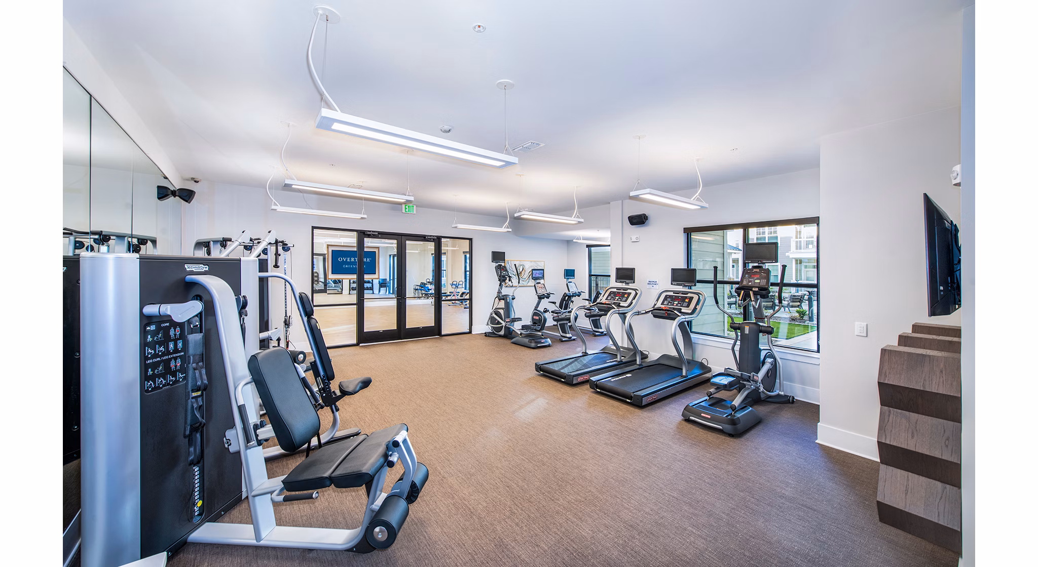 State-of-the-art fitness center with modern equipment at Overture Greenville Apartments for active lifestyles