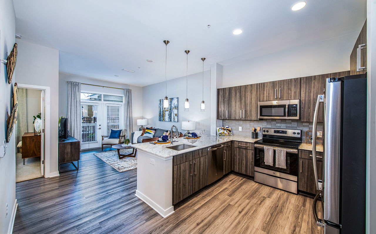 Modern kitchen with stainless steel appliances at Overture Greenville Apartments