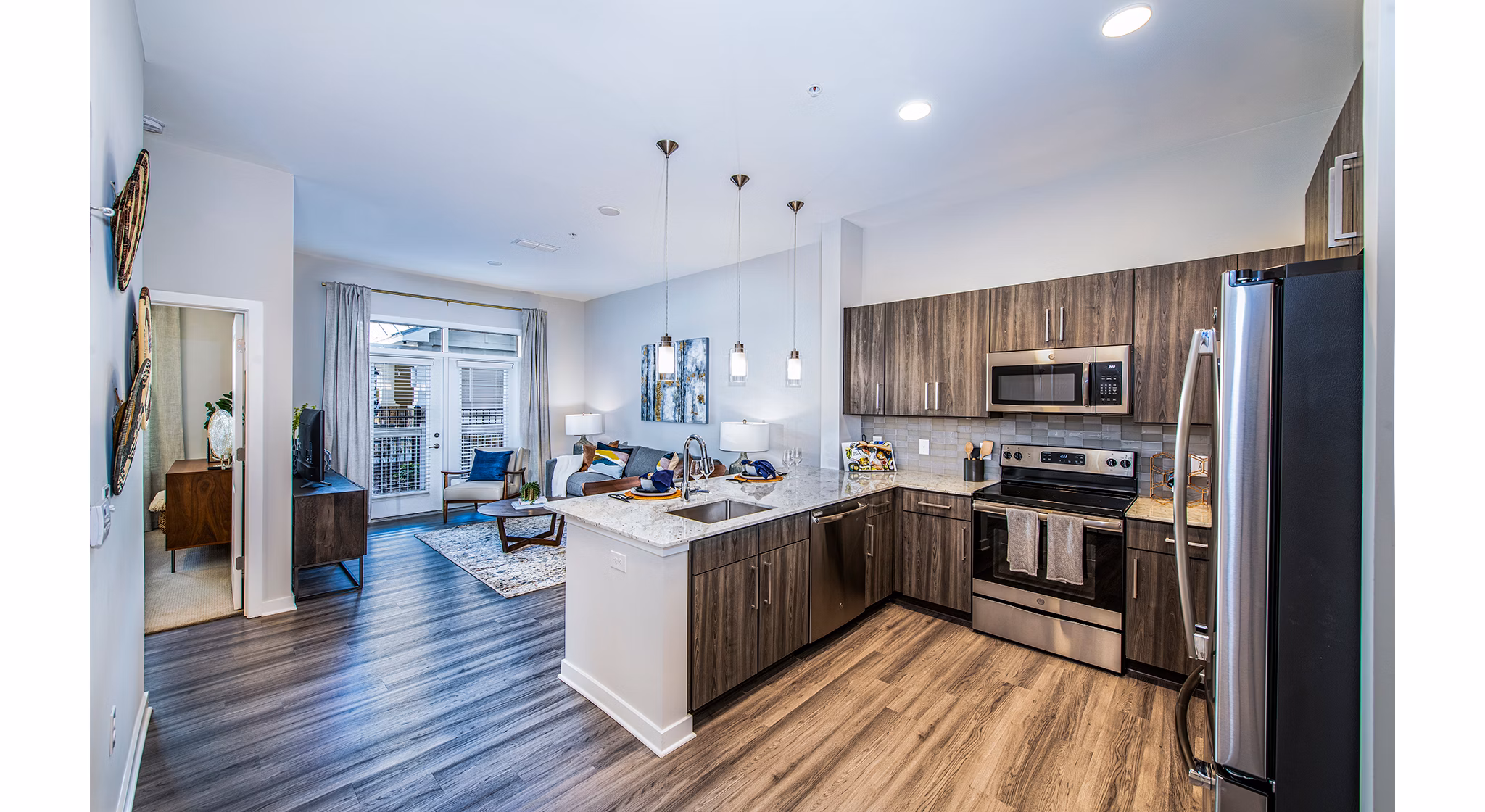 Modern kitchen with stainless steel appliances at Overture Greenville Apartments