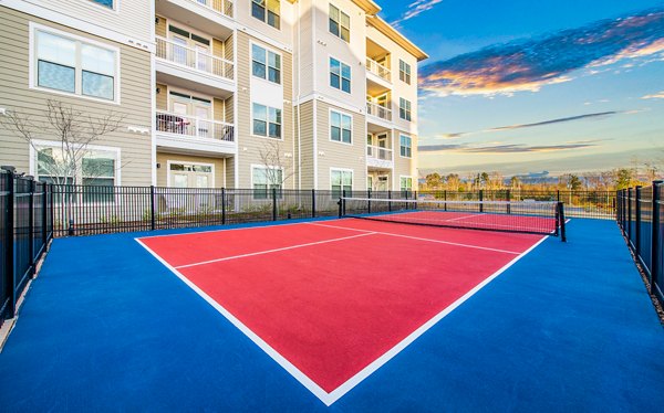 tennis court at Overture Greenville Apartments
