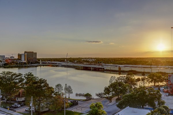 The Yard at Ivanhoe: Stunning sunset view from balcony overlooking city skyline at luxury apartments