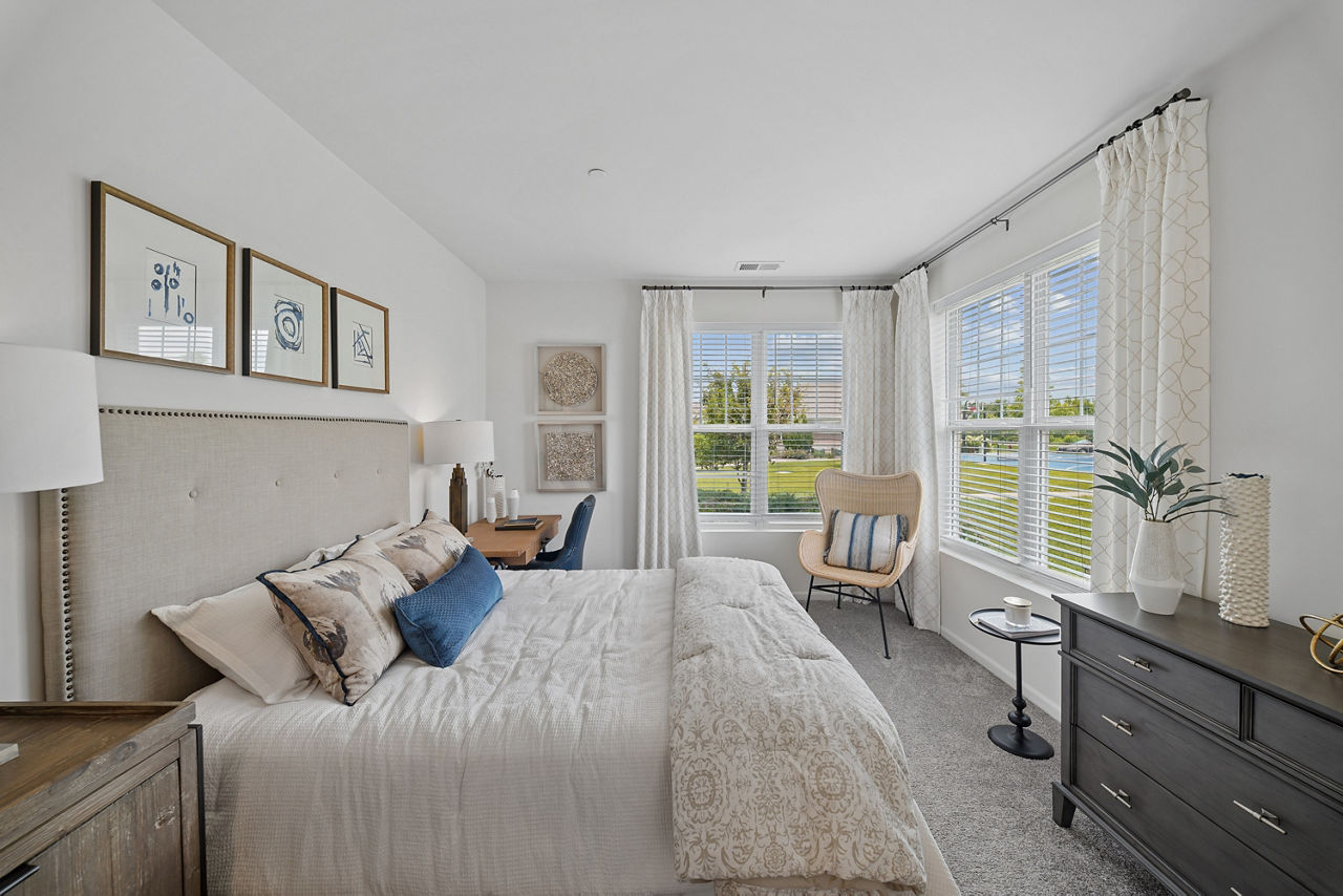 Cozy bedroom with natural light and modern decor at Highland Ridge Apartments