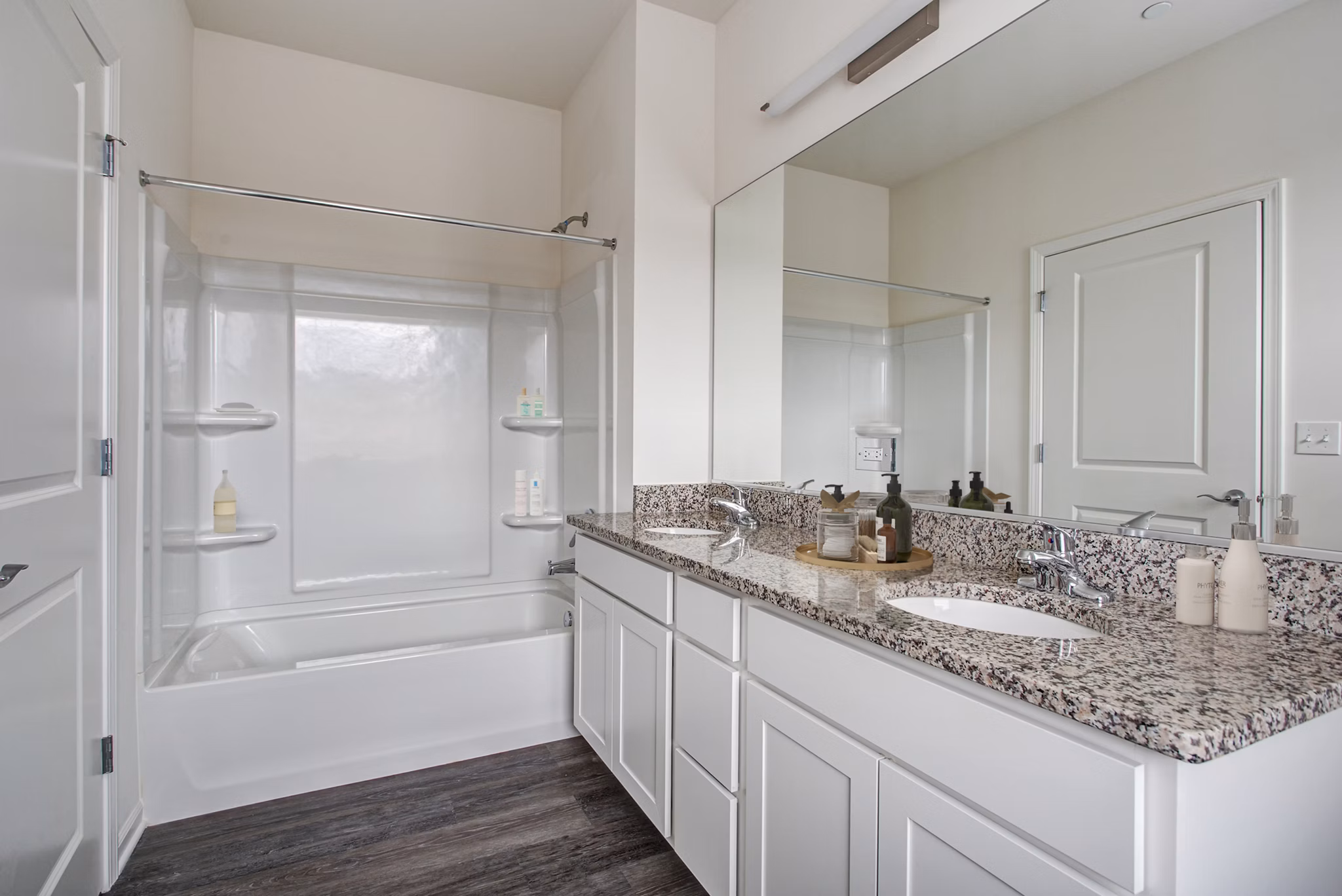 Modern bathroom featuring sleek fixtures and marble countertops at Highland Ridge Apartments, a luxury  community