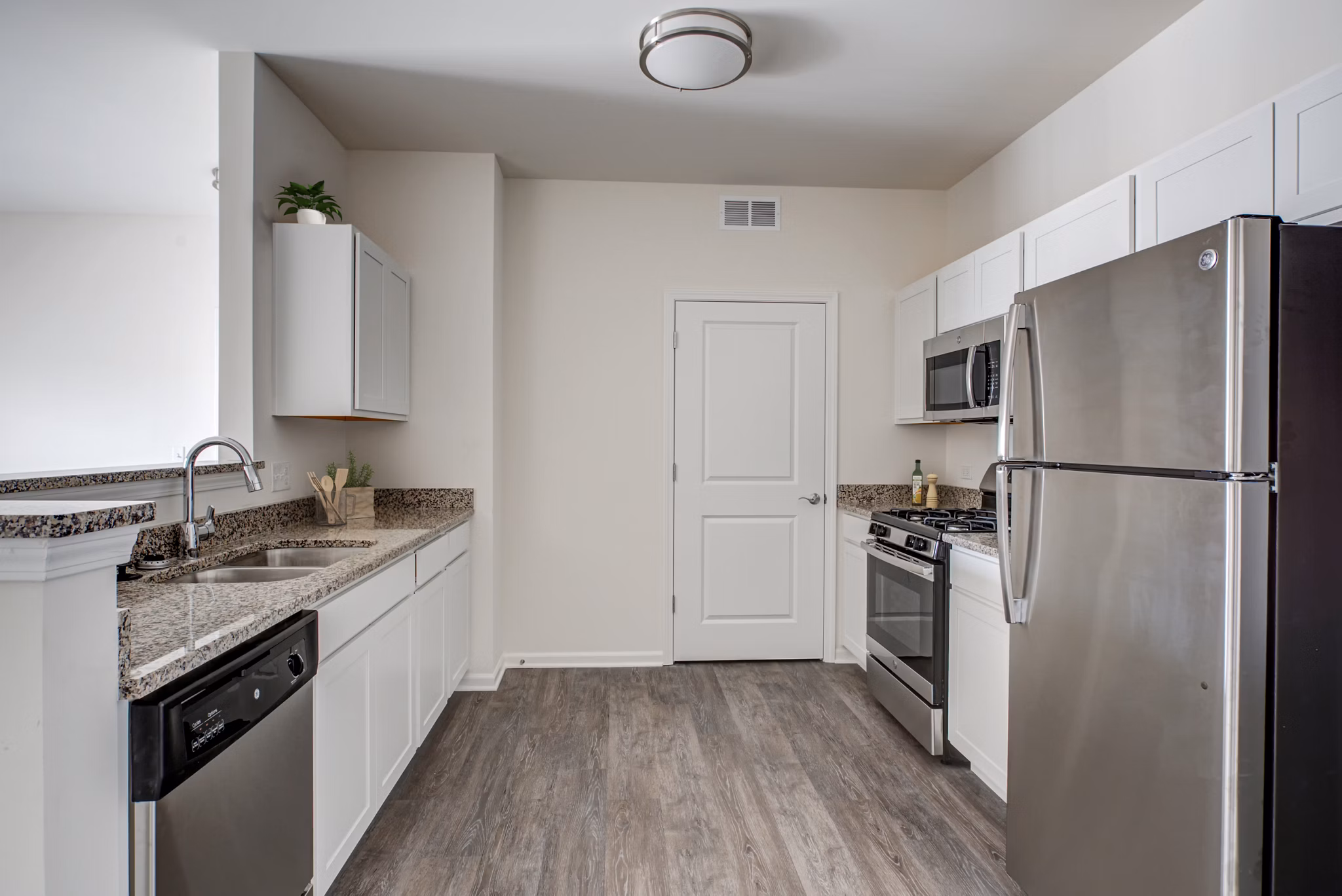 Modern kitchen with stainless steel appliances at Highland Ridge Apartments