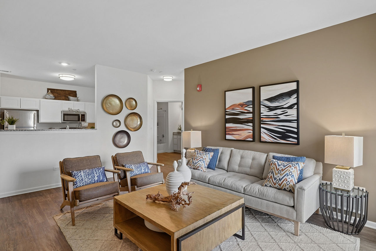 Spacious living room with modern furnishings in Highland Ridge Apartments
