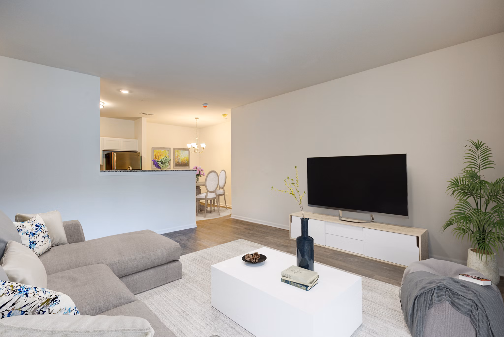 Chic living room with modern decor and ample natural light in Highland Ridge Apartments