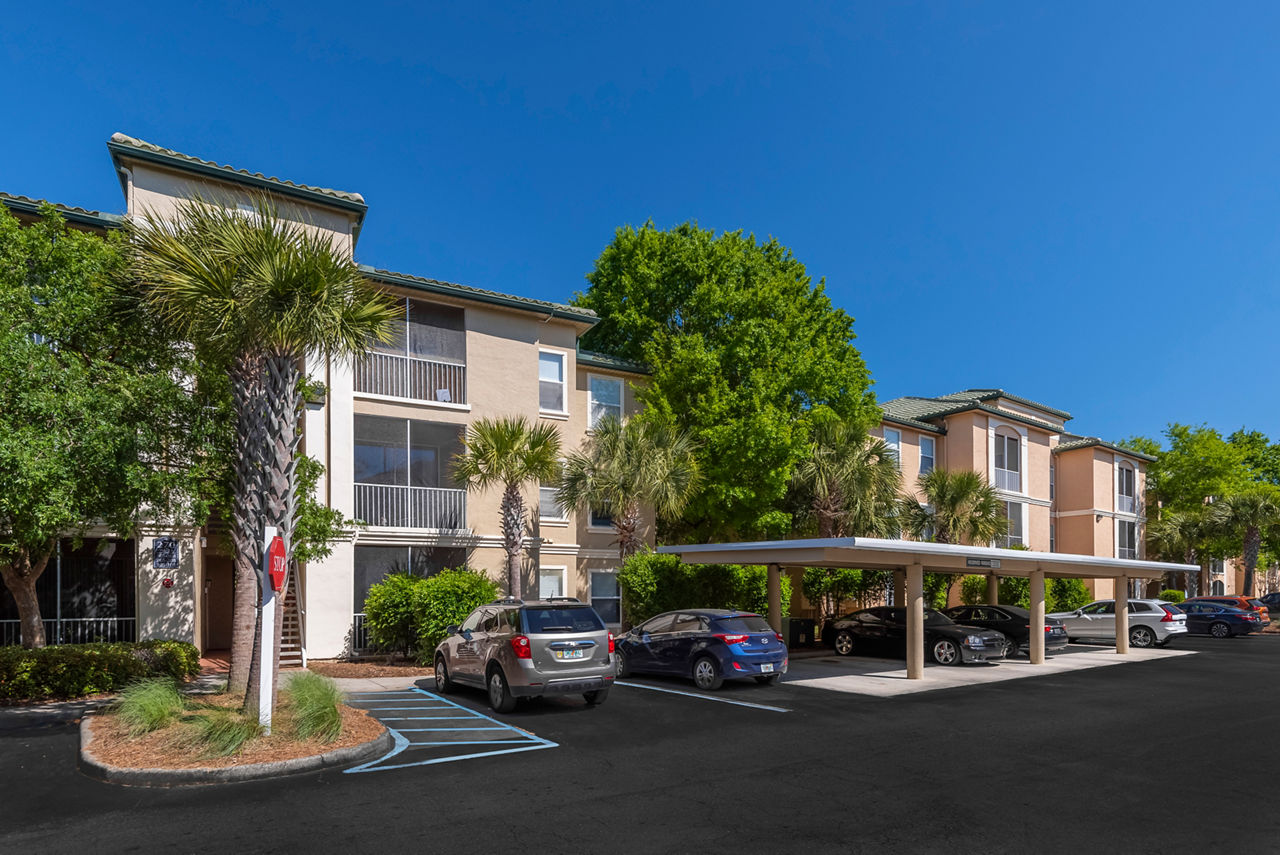 Legacy On The Bay: Coastal-style luxury apartments with palm-lined pathways in Destin