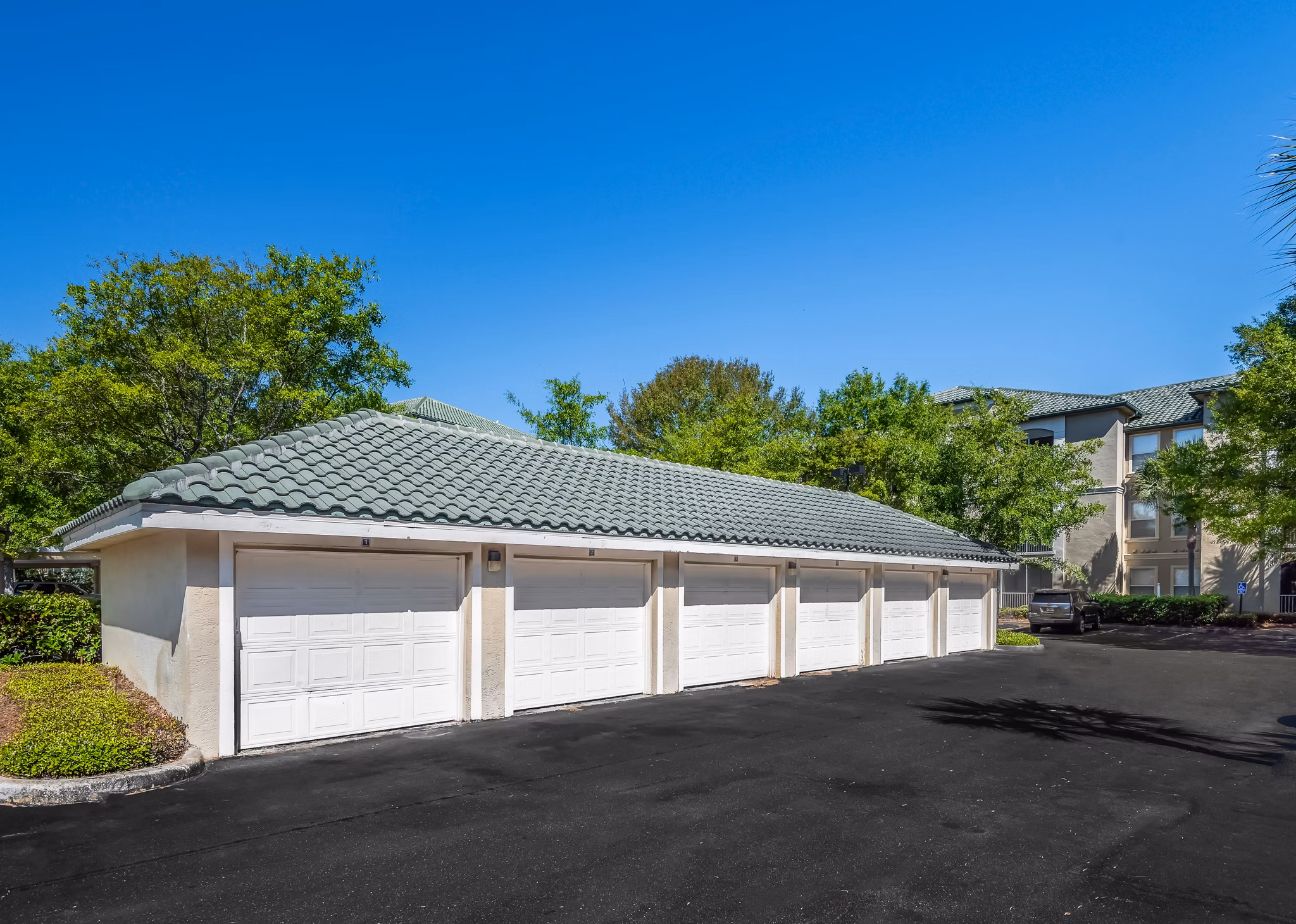 Parking garage at Legacy On The Bay Apartments offering convenient and secure resident parking in a luxury setting