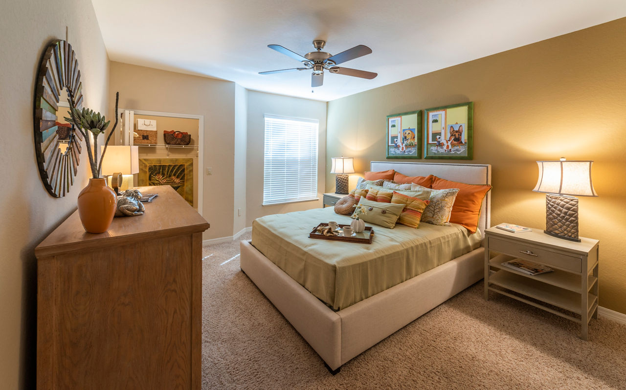 Luxury bedroom featuring elegant modern design at Legacy On The Bay Apartments in a serene coastal setting