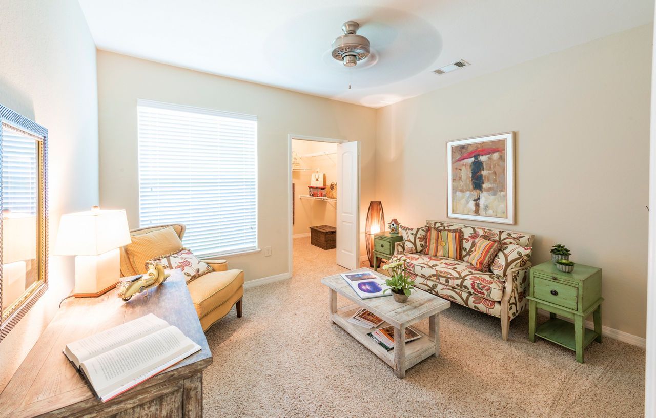 Luxurious bedroom with coastal-inspired decor at Legacy On The Bay Apartments