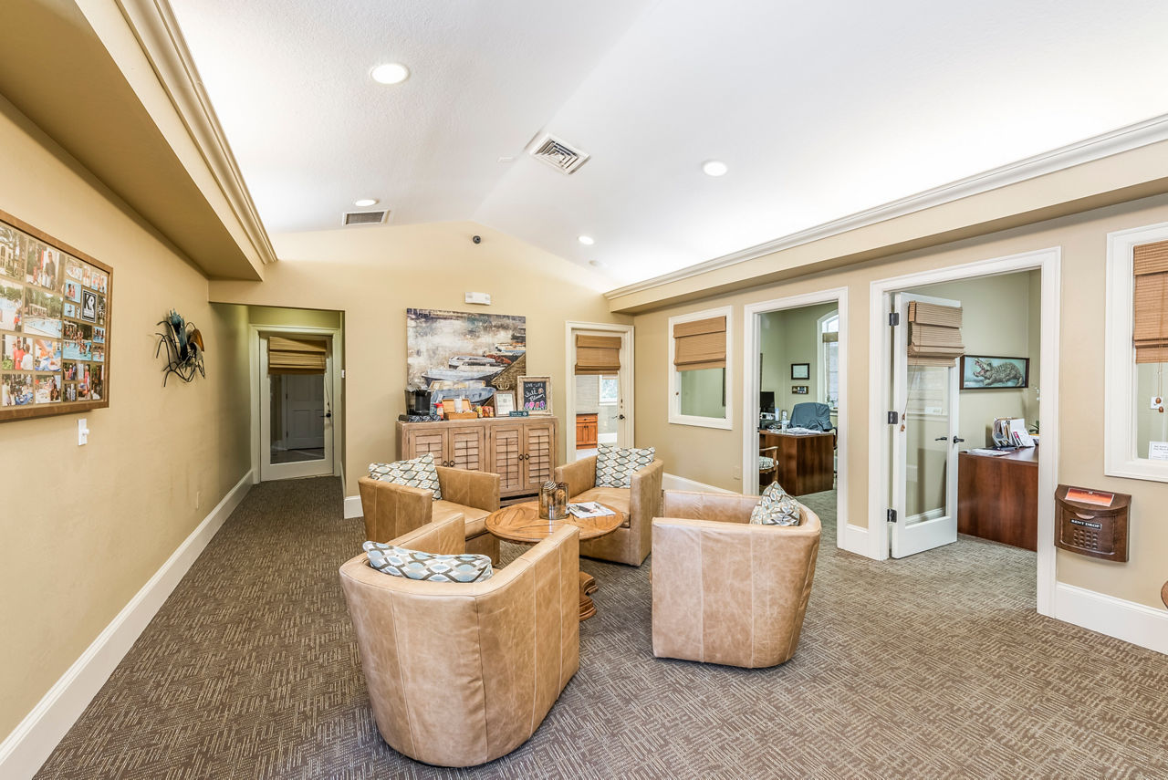 Clubhouse featuring modern design and comfortable seating at Legacy On The Bay Apartments in Florida