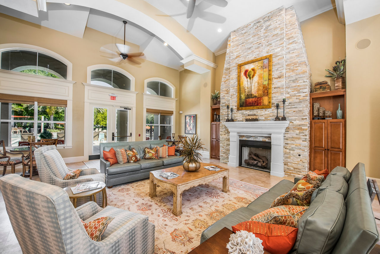 Clubhouse with stylish seating and modern decor at Legacy On The Bay Apartments in Florida, offering luxurious communal spaces for residents
