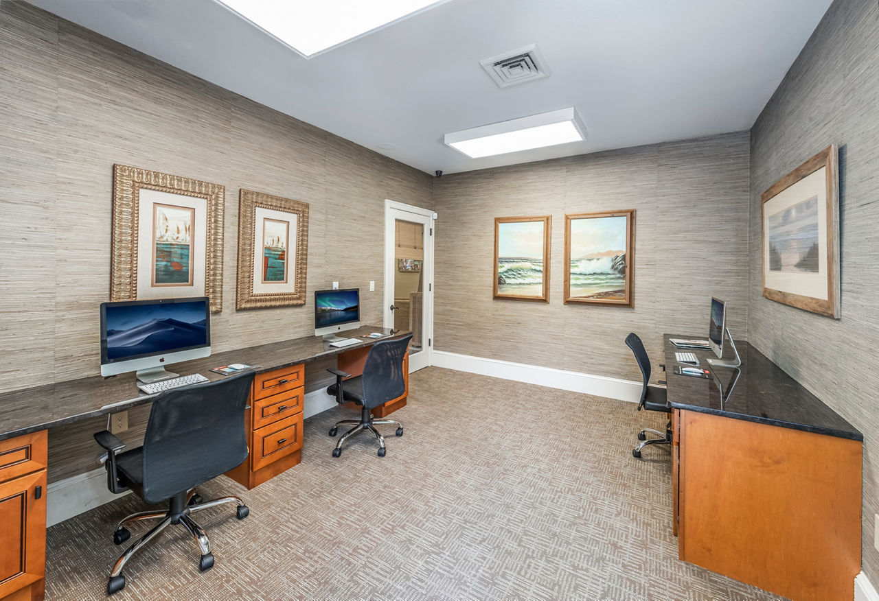 Modern business center with sleek workstations at Legacy On The Bay Apartments, ideal for remote workers and professionals