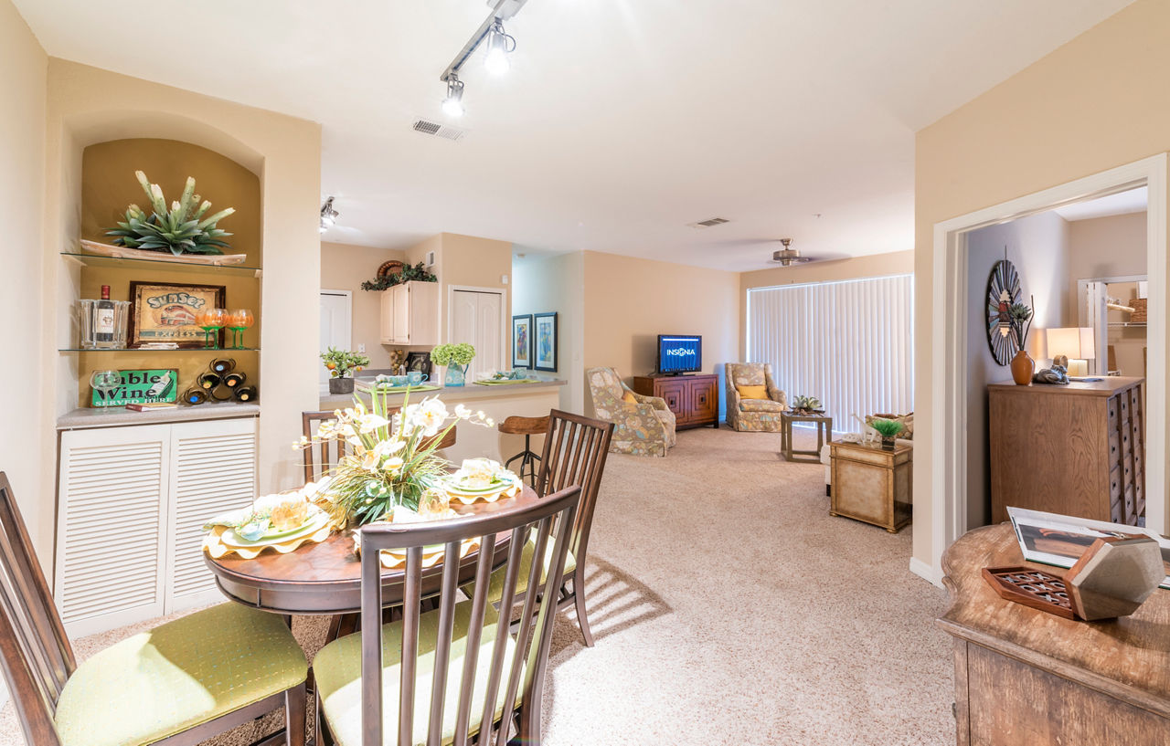 Dining room with elegant decor at Legacy On The Bay Apartments in Destin, offering luxury coastal living