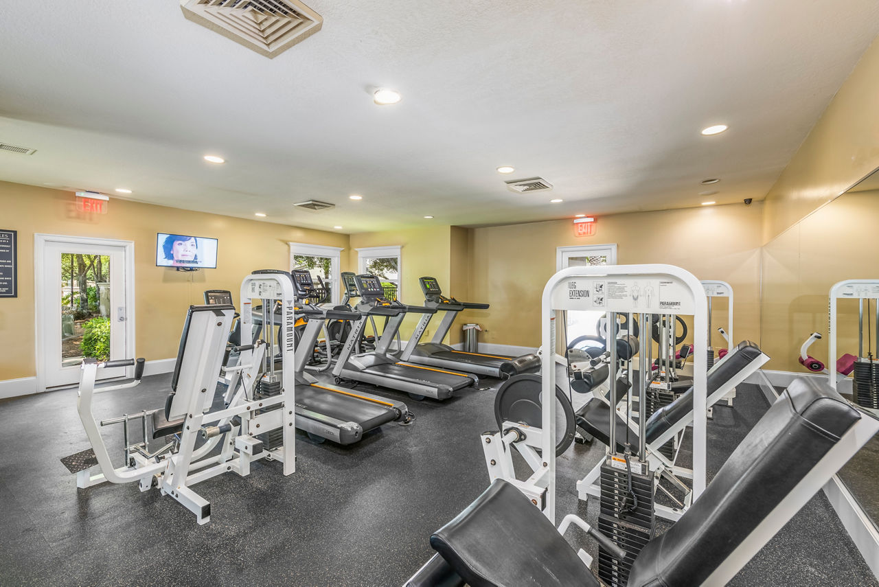 Spacious fitness center featuring top-notch equipment at Legacy On The Bay Apartments Ideal for residents seeking an active lifestyle