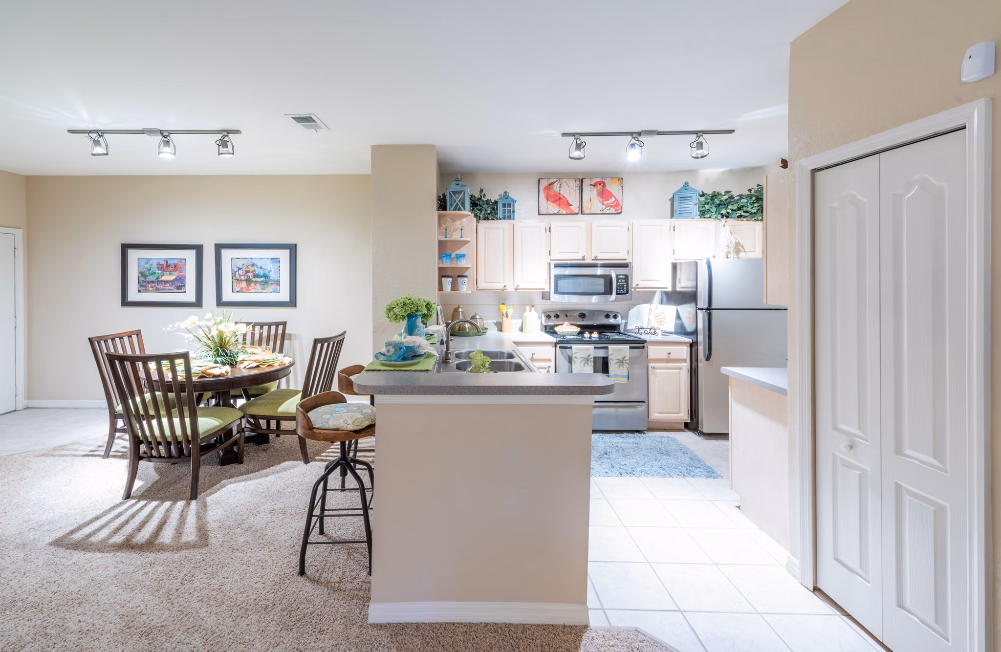 Modern kitchen with stainless steel appliances in Legacy On The Bay Apartments