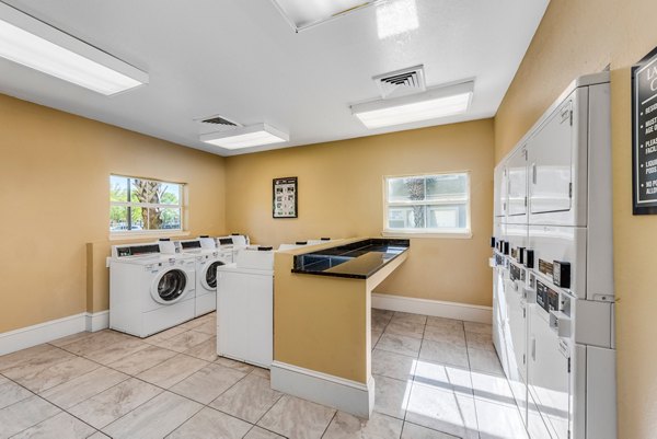 laundry facility at Legacy On The Bay Apartments