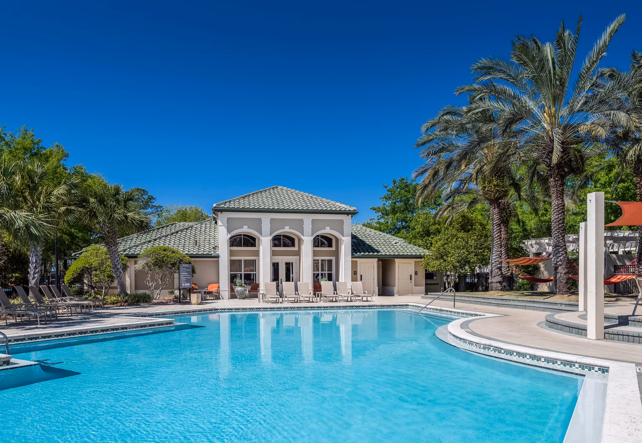 Inviting outdoor pool at Legacy On The Bay Apartments, ideal for relaxation and recreation