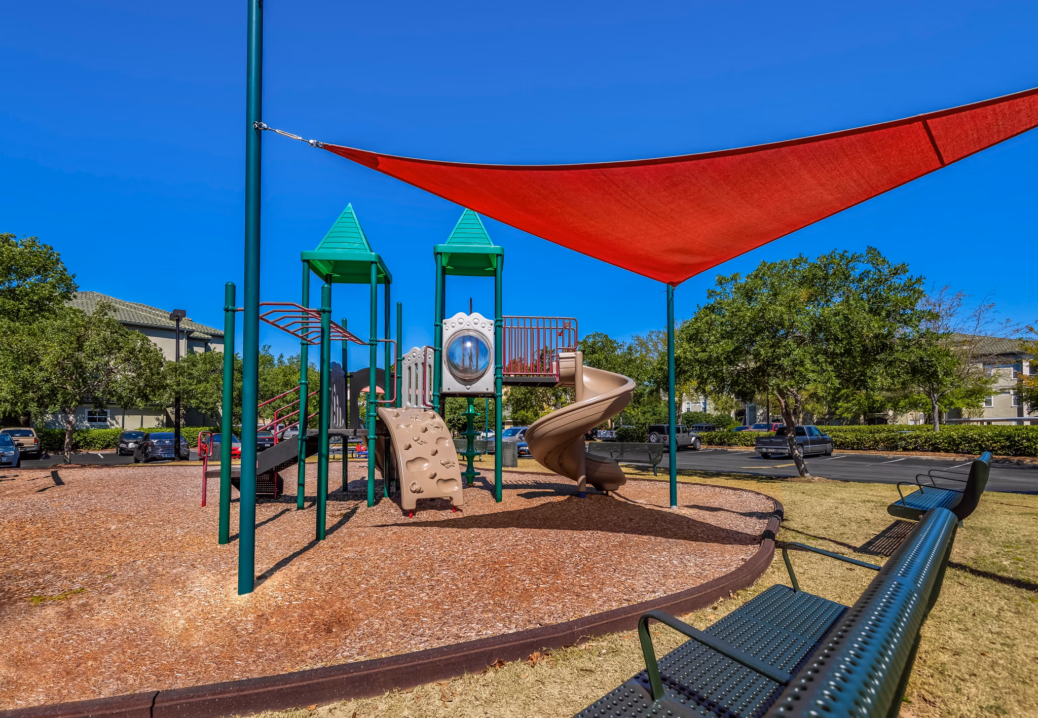Playful children's playground at Legacy On The Bay Apartments in Destin, offering family-friendly amenities for residents