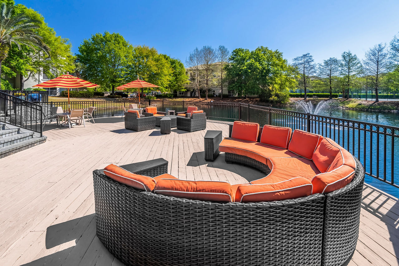Relaxing patio with comfortable seating at Legacy On The Bay Apartments, a luxury living experience by the beach