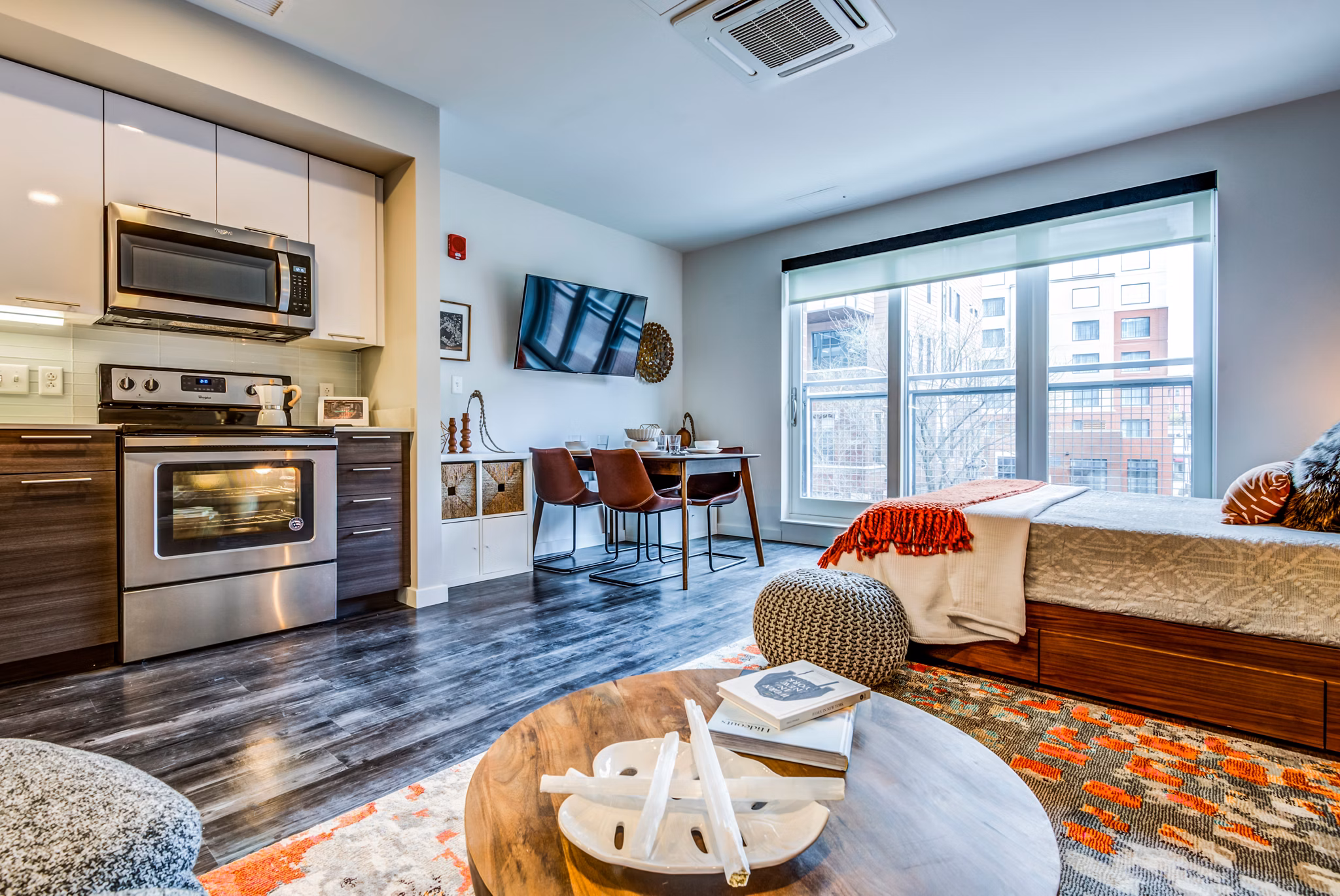 Modern kitchen featuring sleek cabinetry and stainless steel appliances in City Centre Ithaca Apartments