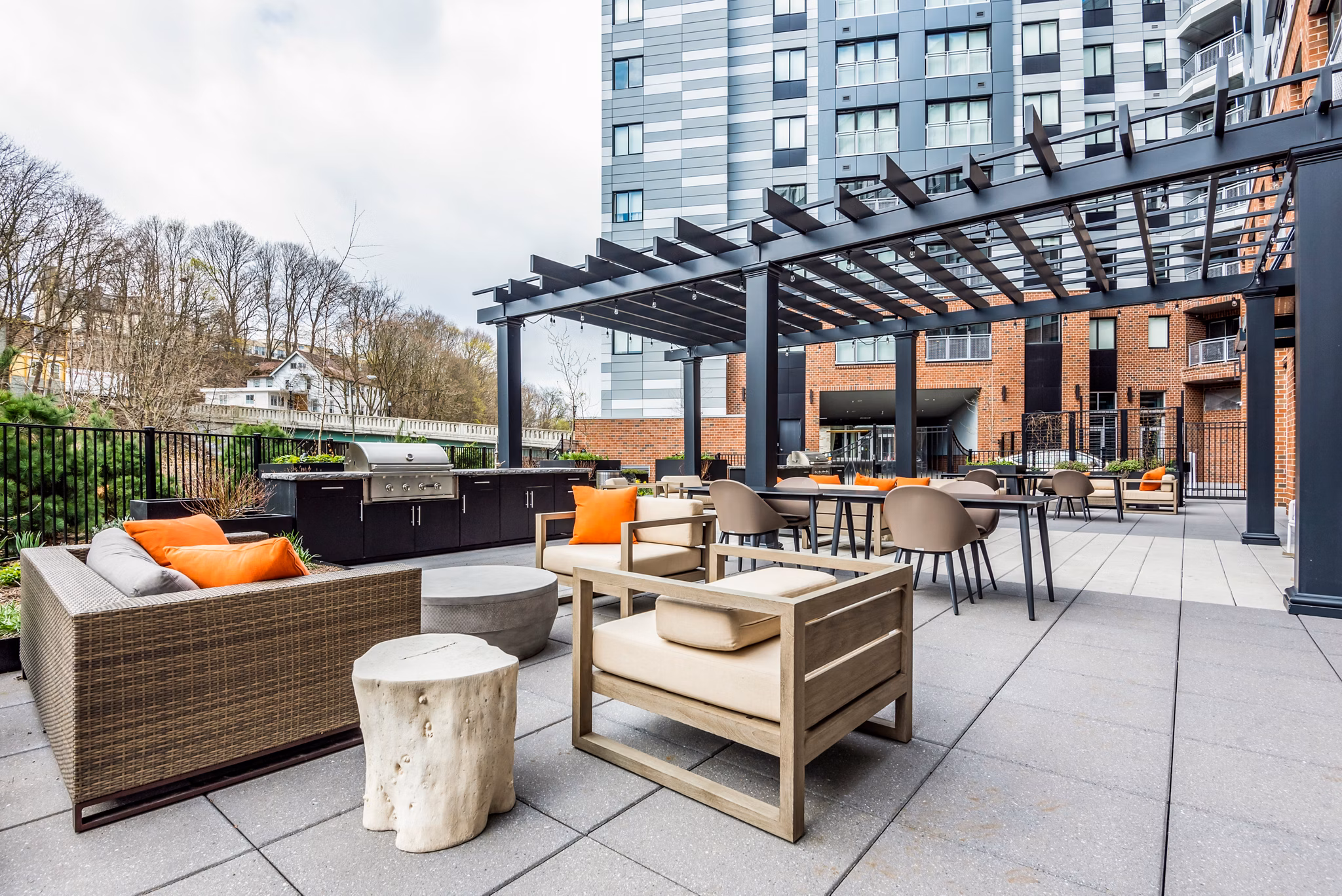 Outdoor grill area equipped with modern BBQ facilities at City Centre Ithaca Apartments
