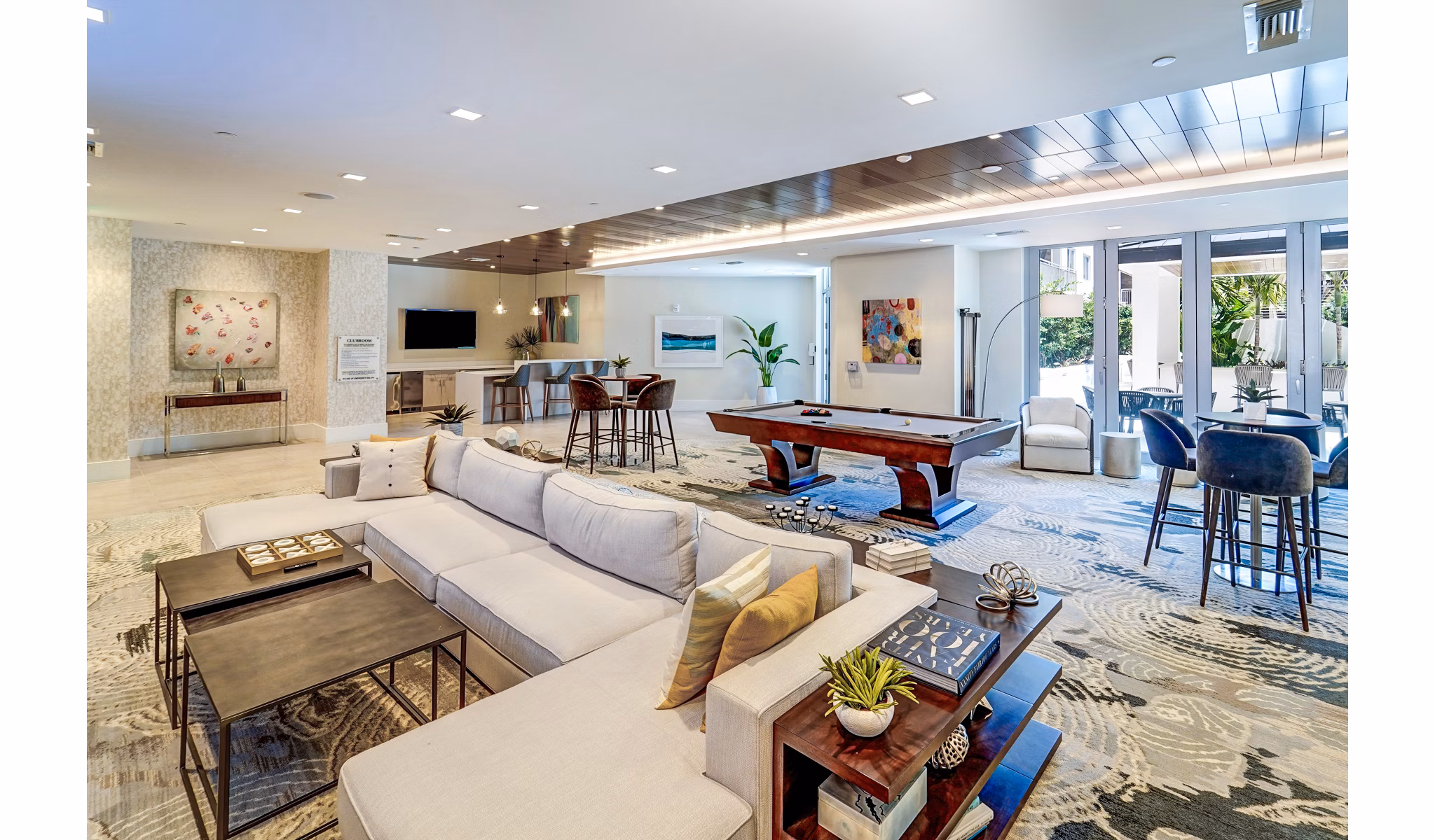 Modern clubhouse with elegant seating at Oversea at Flagler Banyan Square Apartments, a Greystar luxury community in West Palm Beach, FL