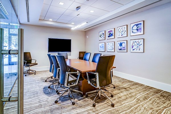 Modern meeting facility with state-of-the-art equipment at Oversea at Flagler Banyan Square Apartments, perfect for tenant gatherings and events