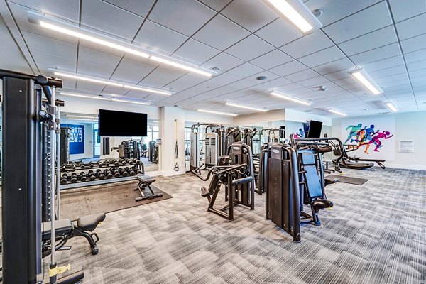 State-of-the-art fitness center at Oversea at Flagler Banyan Square luxury apartments with modern equipment and spacious workout areas