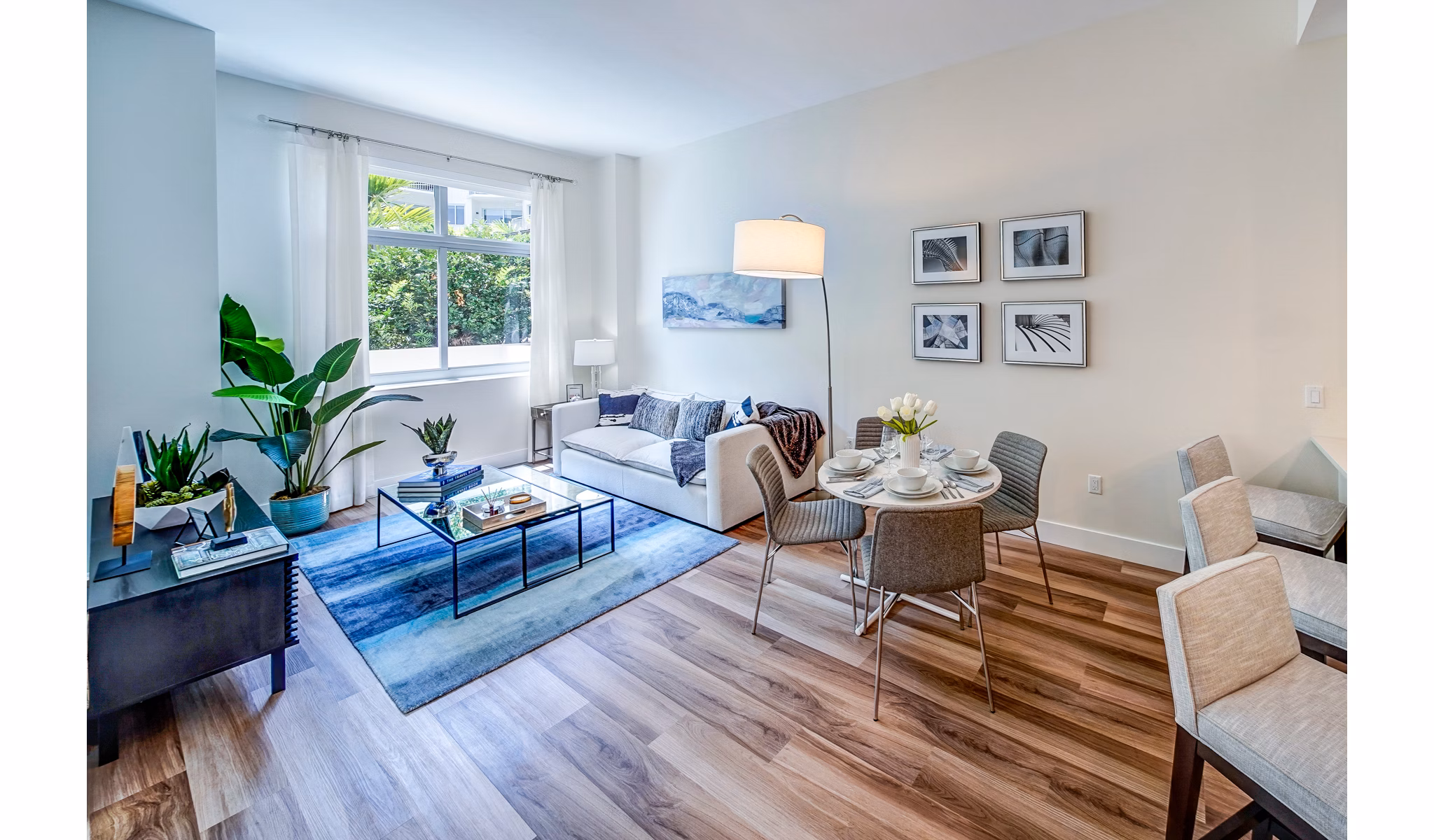 Spacious living room with modern furnishings in Oversea at Flagler Banyan Square Apartments