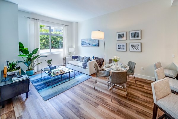 Spacious living room with modern furnishings in Oversea at Flagler Banyan Square Apartments